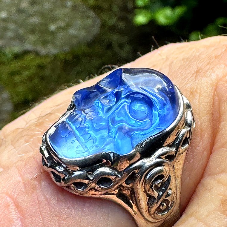 The hand-finished sterling-silver infinity-knot band and skull setting